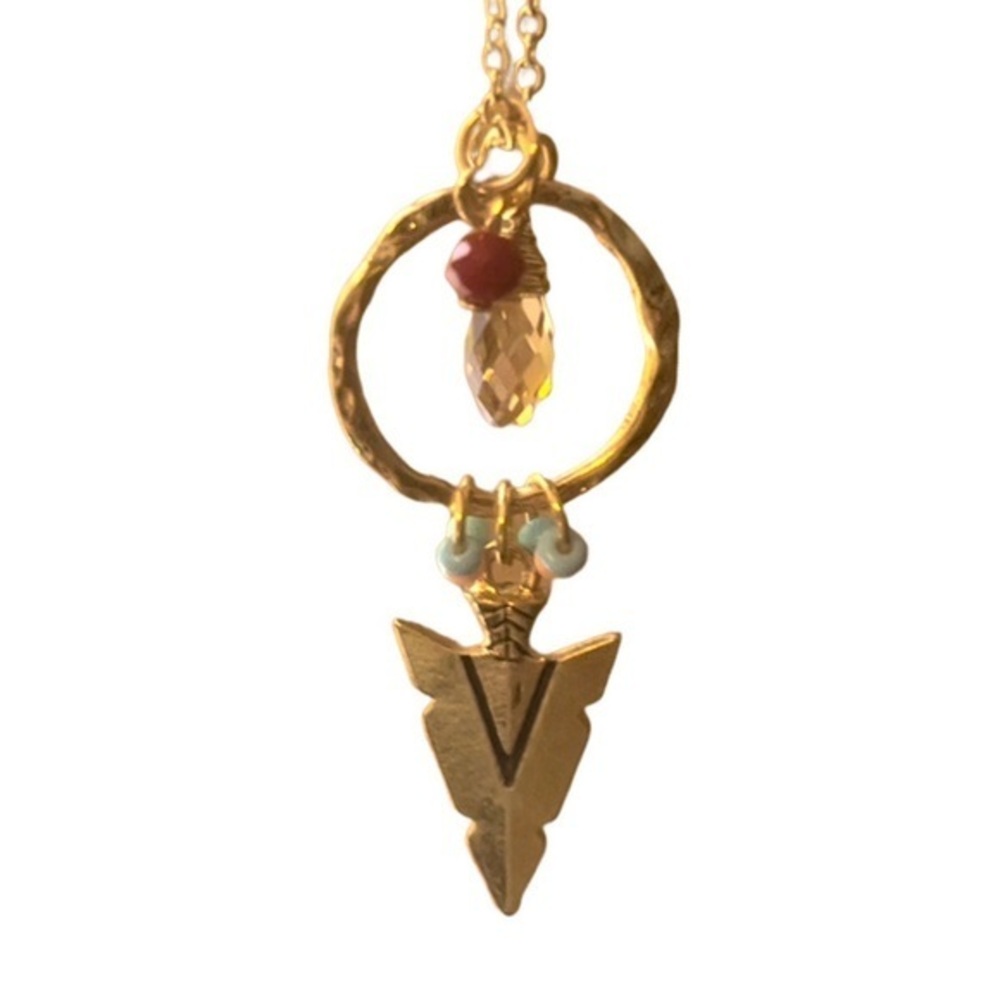 Gold arrowhead necklace.